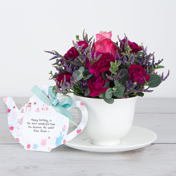 Deep Water Rose, Spray Carnations, Lilac Limonium and Eucalyptus Gunnii inside Bone China Teacup and Saucer