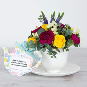 Yellow Spray Roses, Purple Veronicas, Carnations and Eucalyptus in Keepsake Teacup